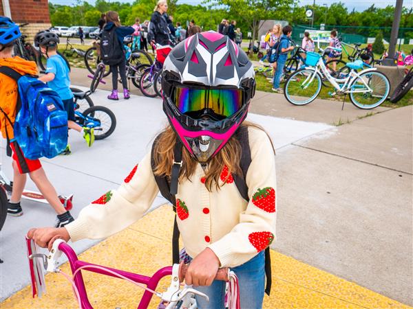 Students bike to school in the morning.